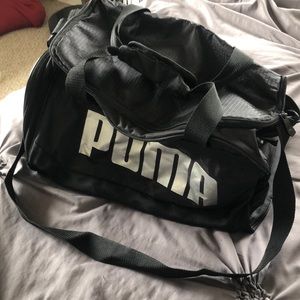 Black gym bag with silver Puma logos